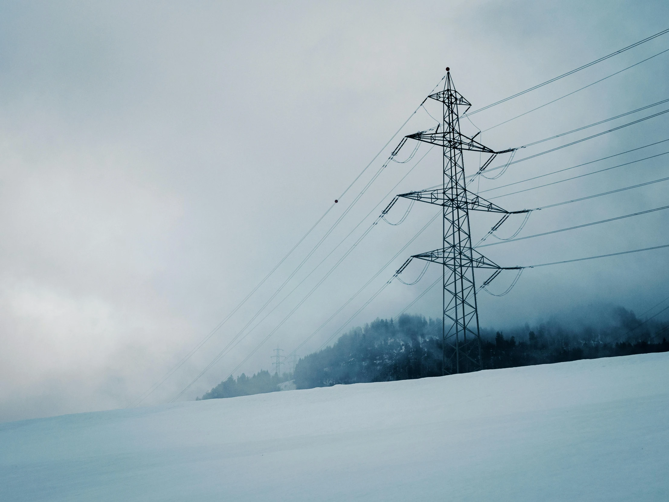 a lone person on skis riding down the slope