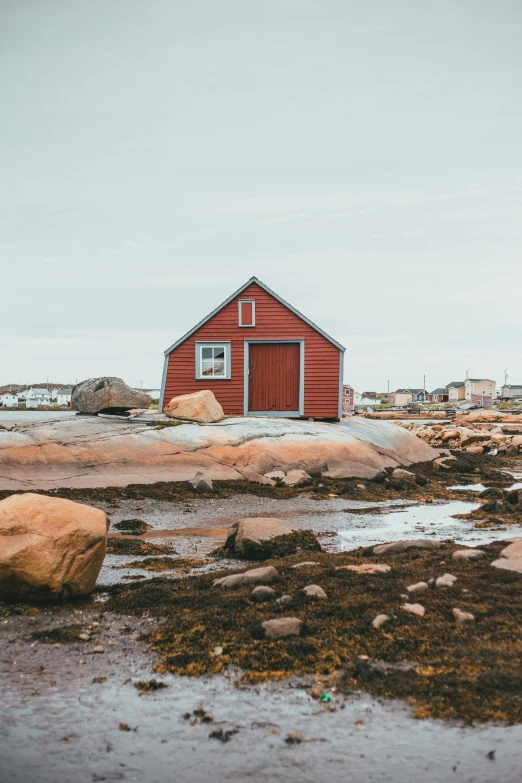 an image of a red building at the beach