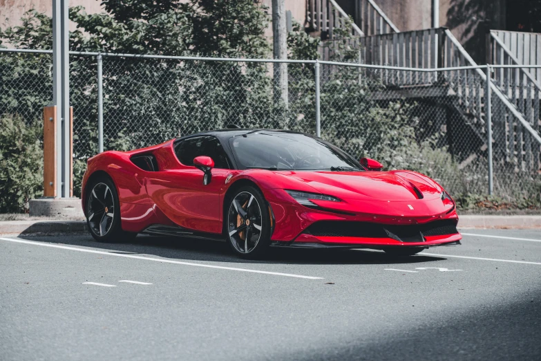 a bright red sports car parked on the street