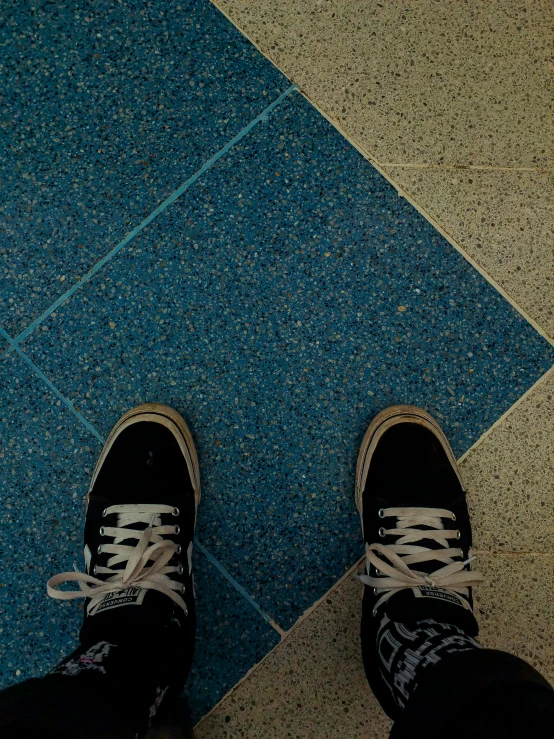 a black and white po of a person wearing shoes