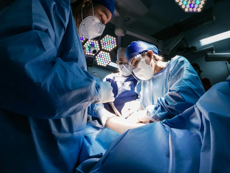 surgeons in the operating room at the hospital
