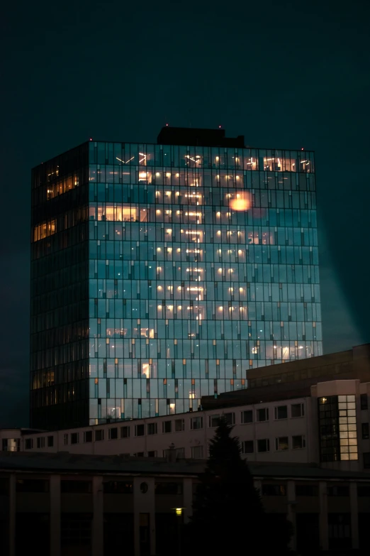 this po shows the reflection of a building lit up