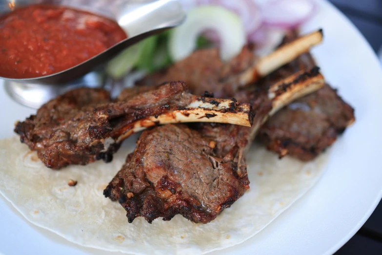 a steak with some other food items on a plate