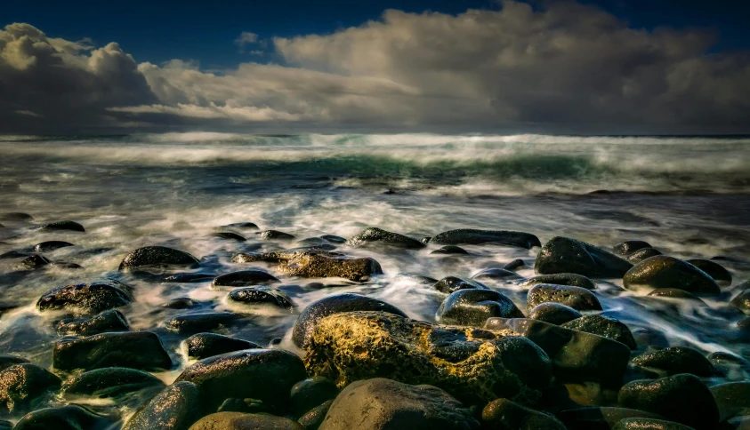 the sea has many large rocks on it