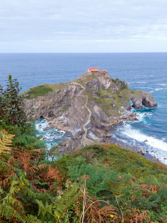 a small house is sitting on the rock