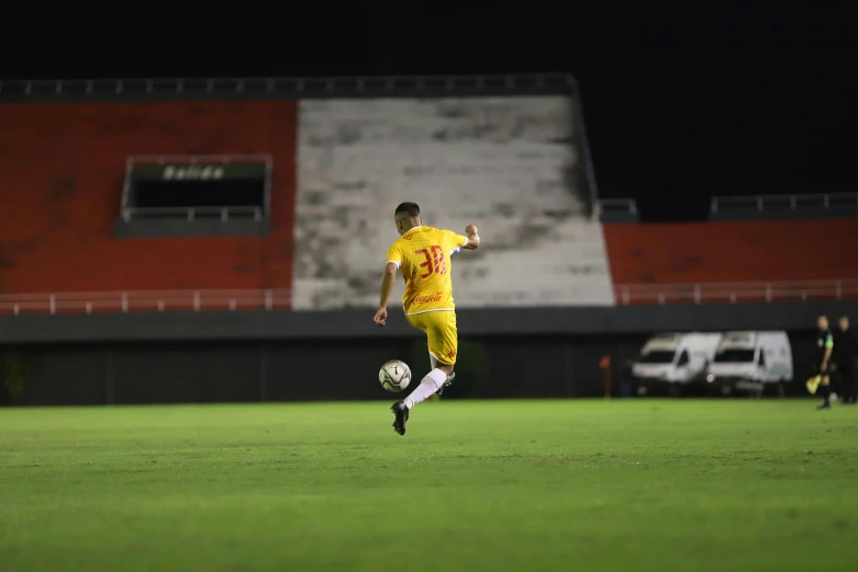 the man is playing soccer on the field