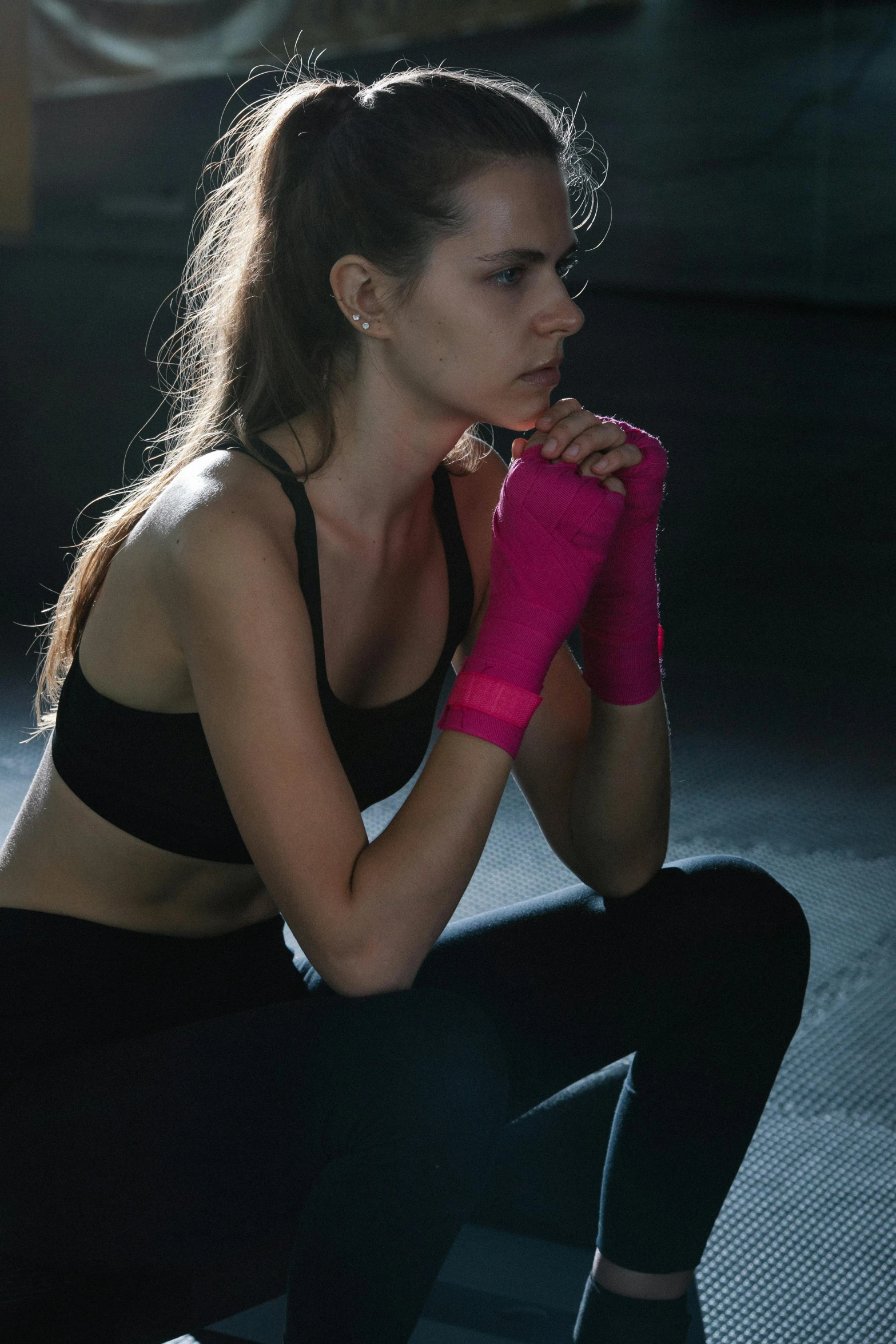 a beautiful young woman wearing a pink glove