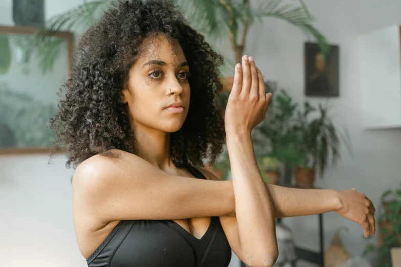 a woman posing for a picture while wearing 