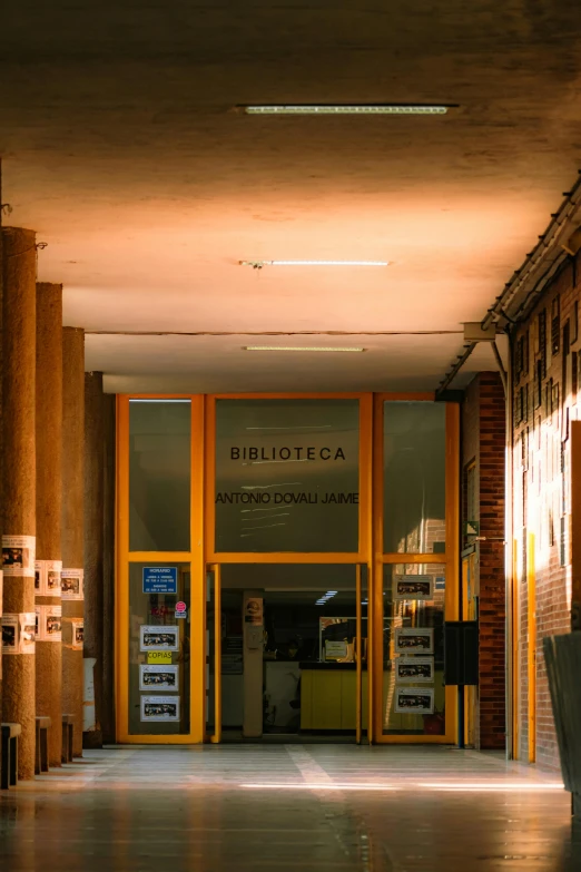 a empty hallway with two wooden buildings behind it