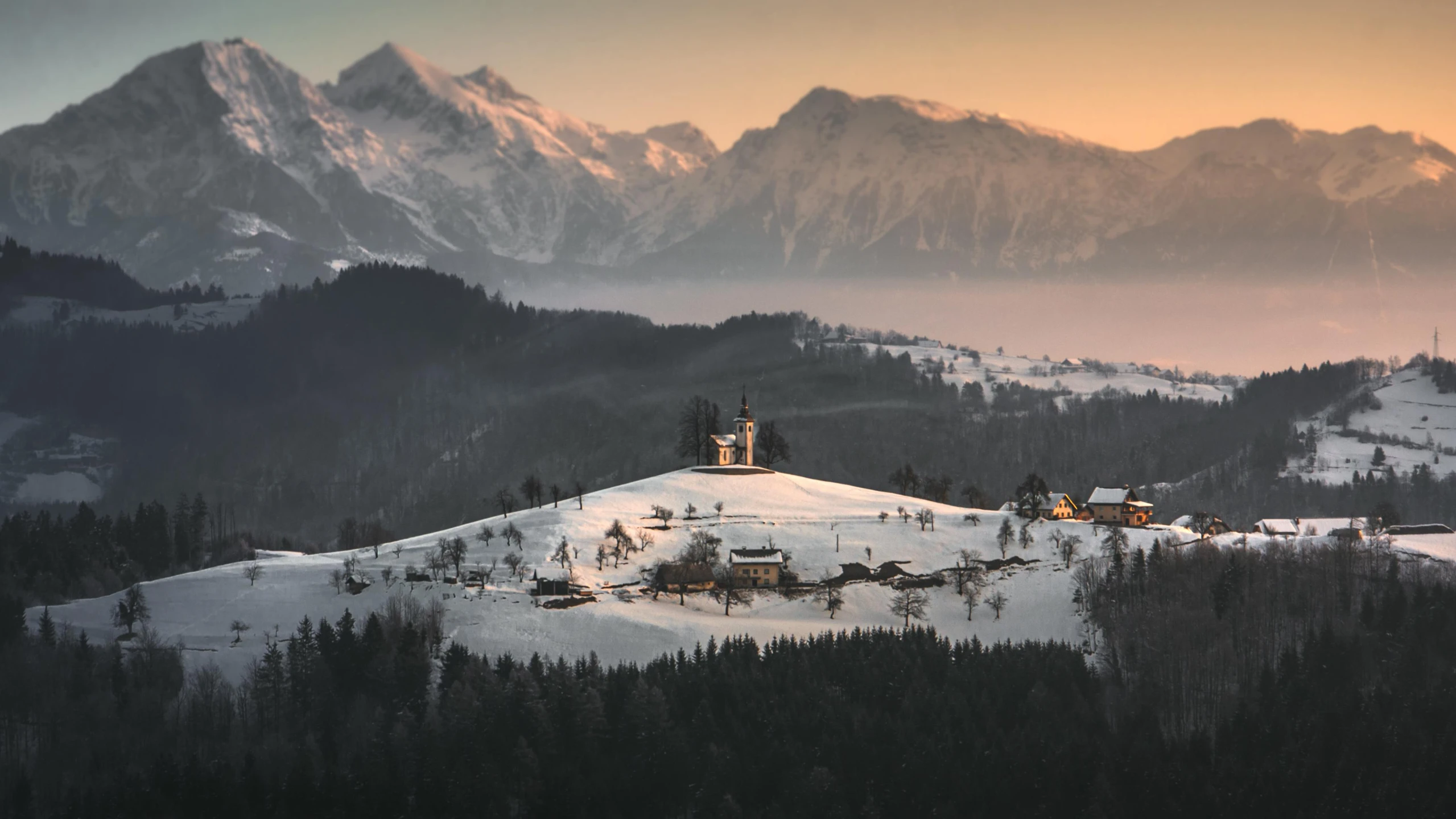 a ski resort in the mountains at sunrise