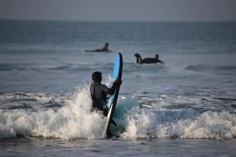 some surfers are on some very big waves