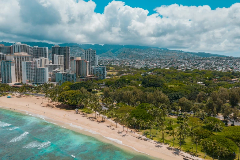 city buildings are near the beach in this aerial po