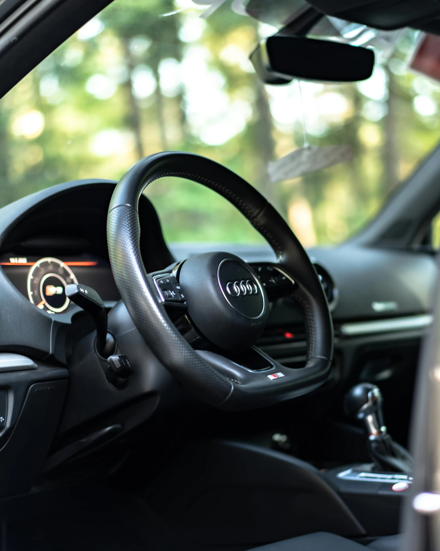 a po of a dash board and steering wheel of a vehicle