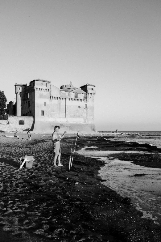 a person flying a kite on the beach