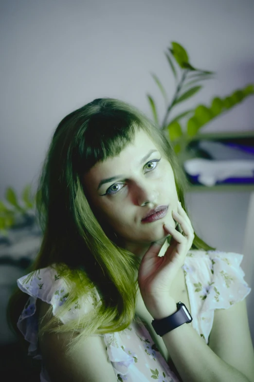 a woman in a dress sitting and smoking a cigarette