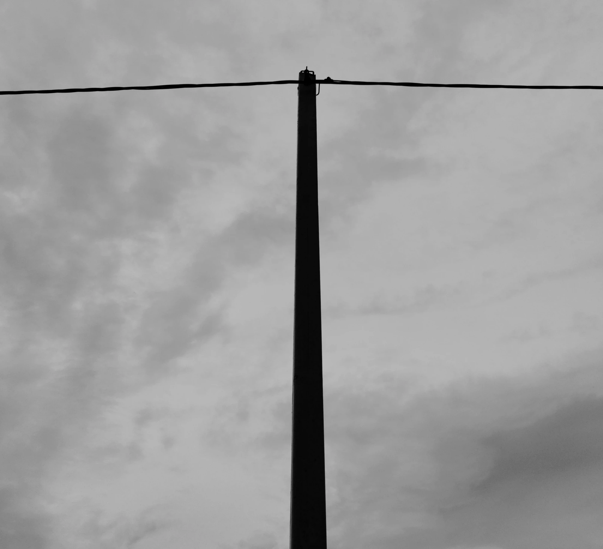 a black and white po of power lines and wires