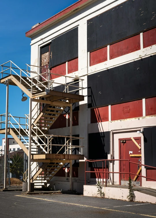 an industrial building has a fire escape outside