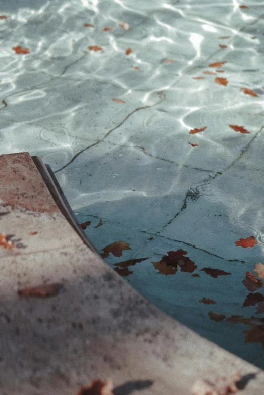 the bottom half of a swimming pool with water