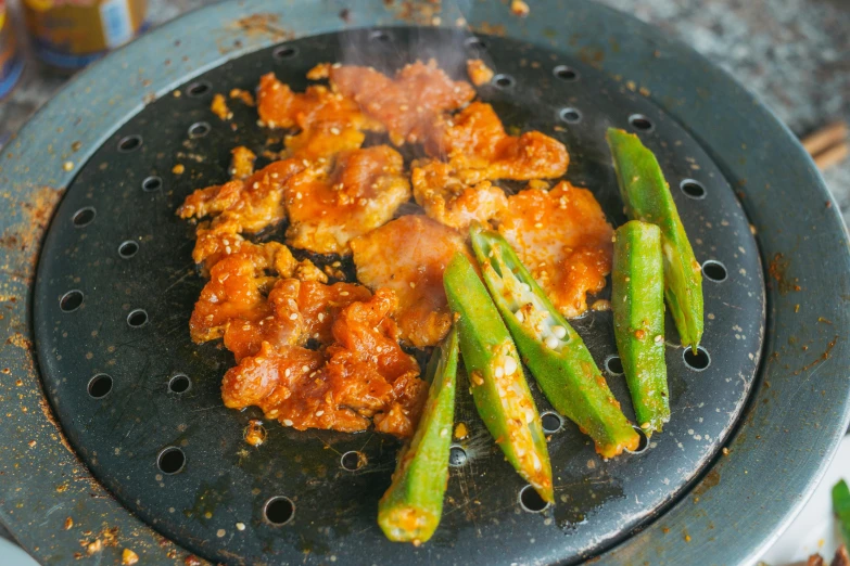 chicken, asparagus and sauce on an electric grill