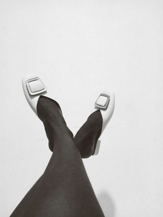 a black and white po with an upside down view of someone's feet