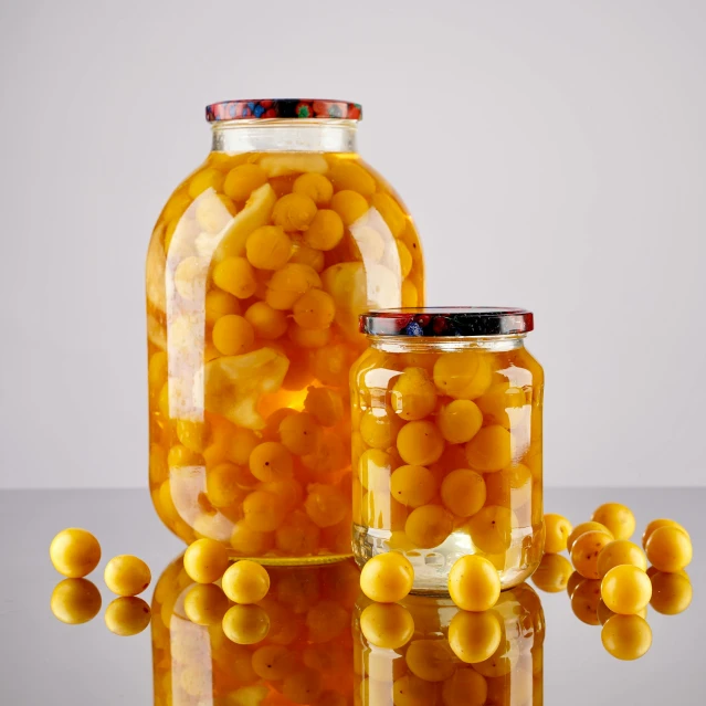 two jars are filled with jelly beans