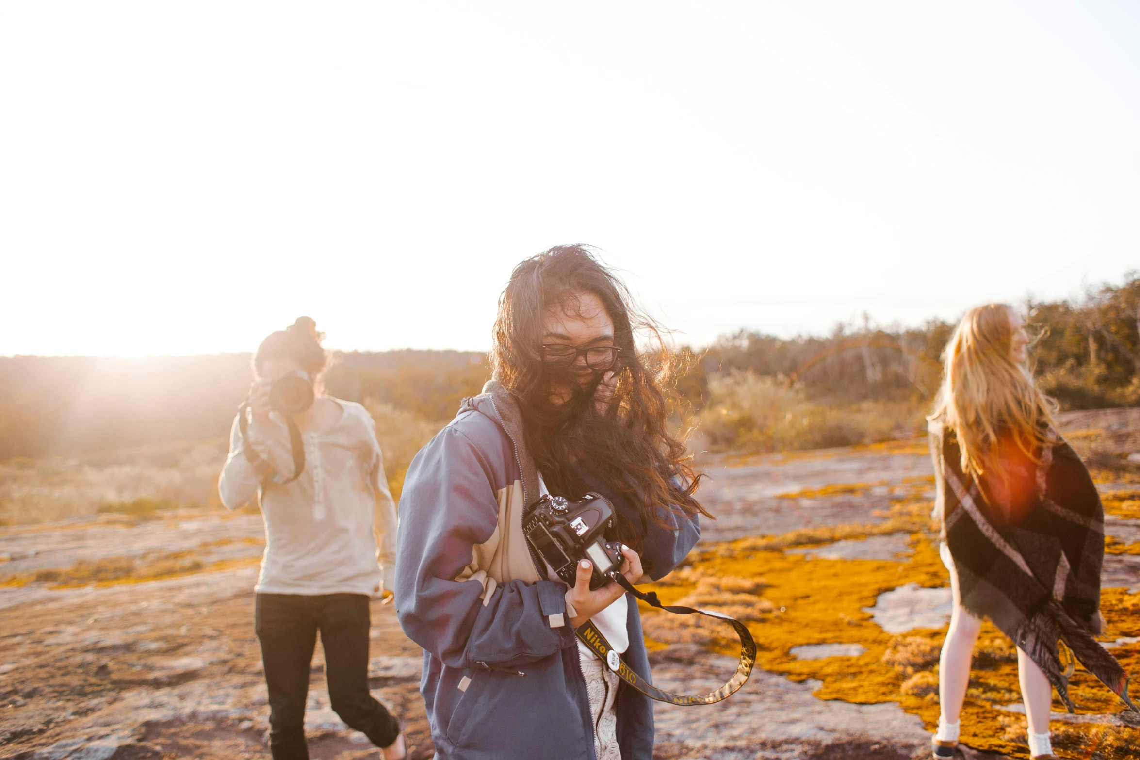 a man with long beard holding a camera