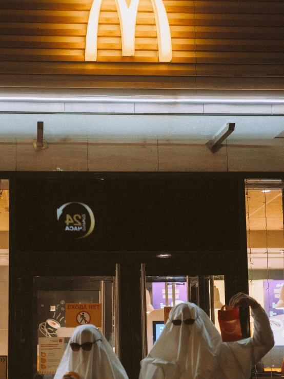 a mcdonalds front entrance decorated like ghost figures