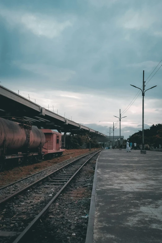 a train parked next to a loading dock at a train station