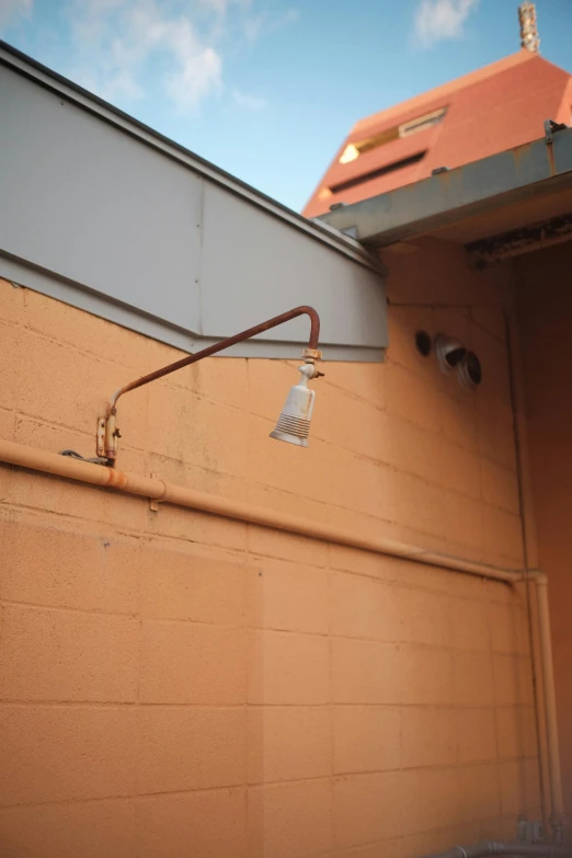 a pipe and faucet outside of a house