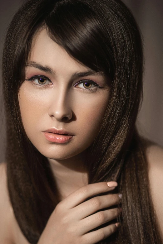 a beautiful woman with very long hair posing for a po