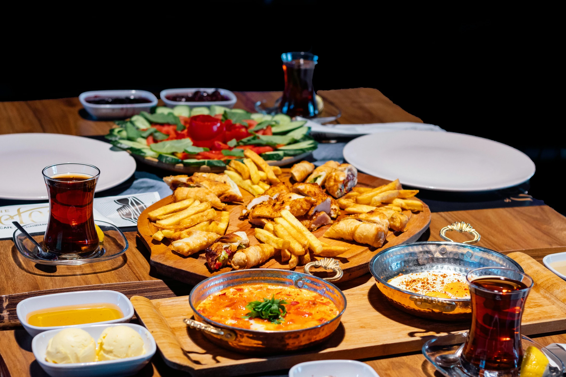 a wooden table filled with assorted food items