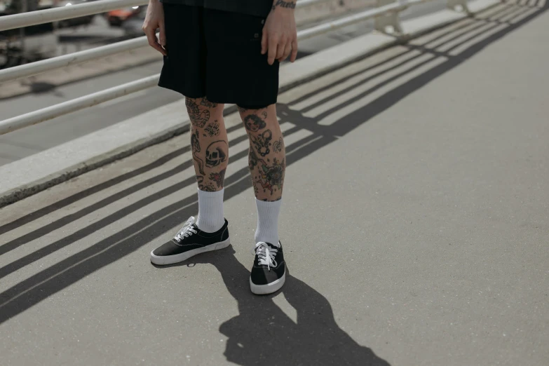 a person standing in front of a metal railing