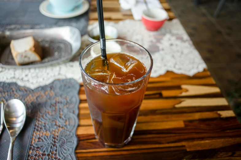 a cup that has a drink in it on a table