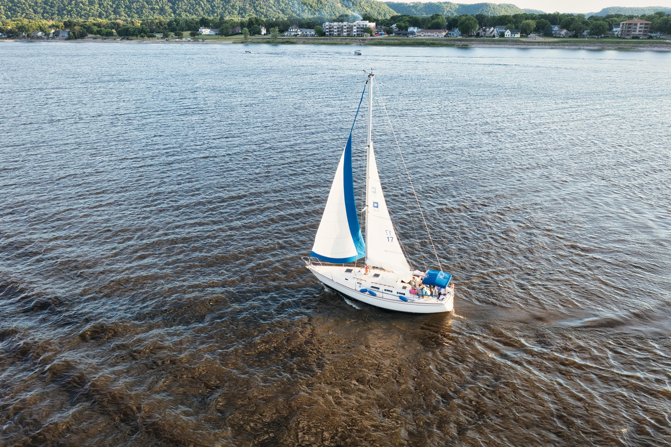 a sail boat in the water on the water