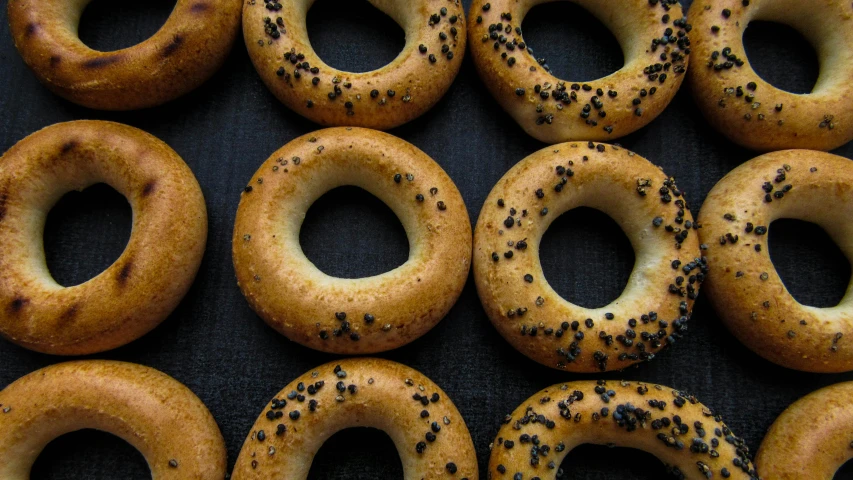 a close up of a bunch of different types of doughnuts