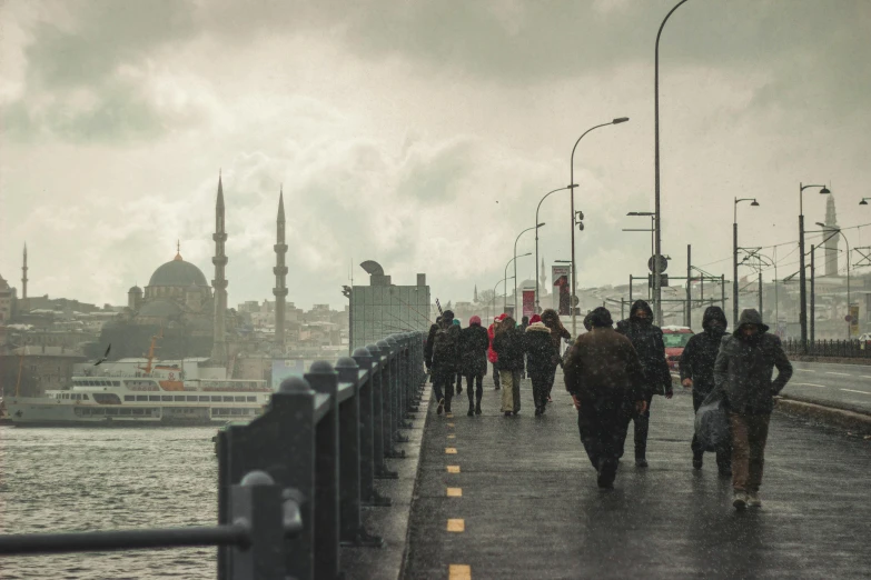 people on a pier during a rain storm