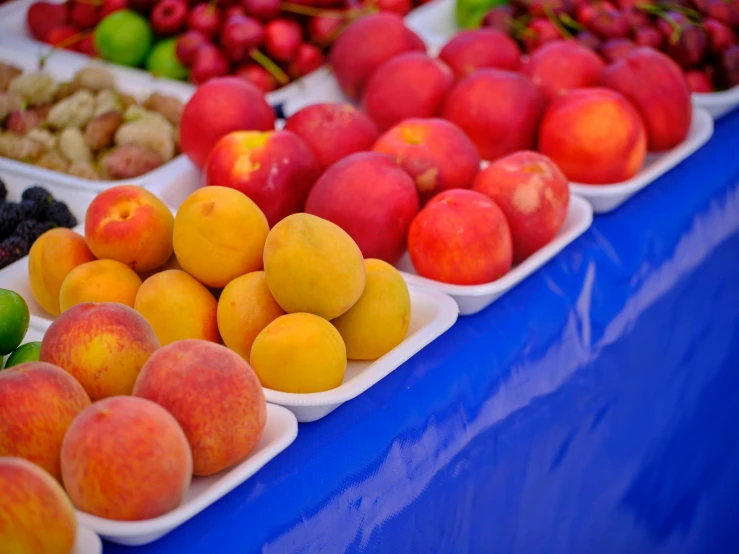 fruit are on a display for people to buy