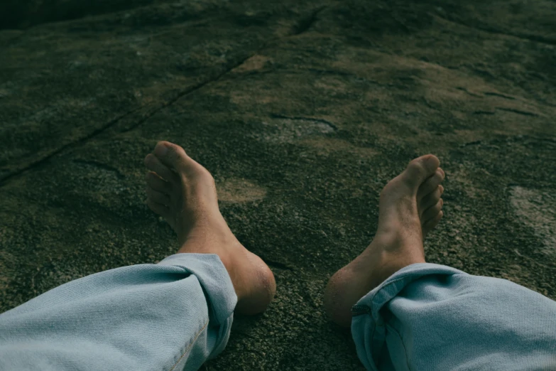 two people standing on the road with their feet in the air