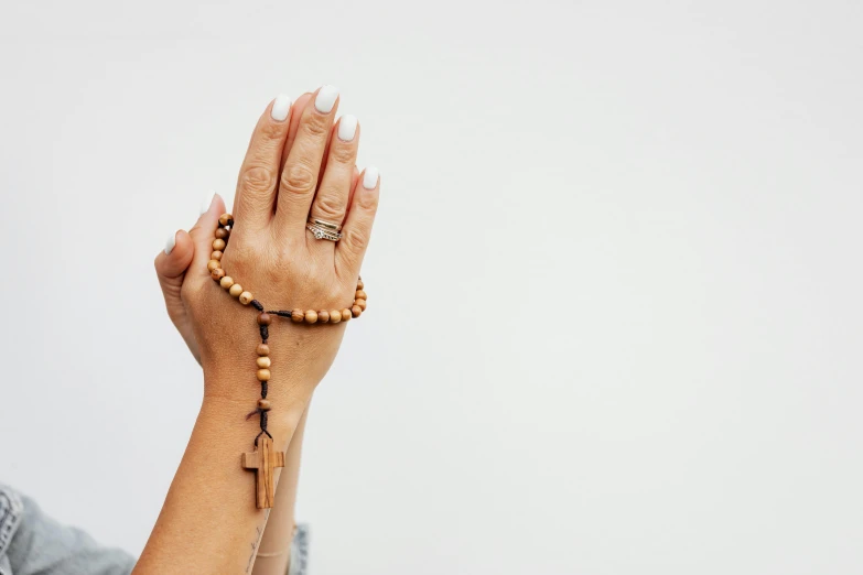 a woman holding her hands in the air