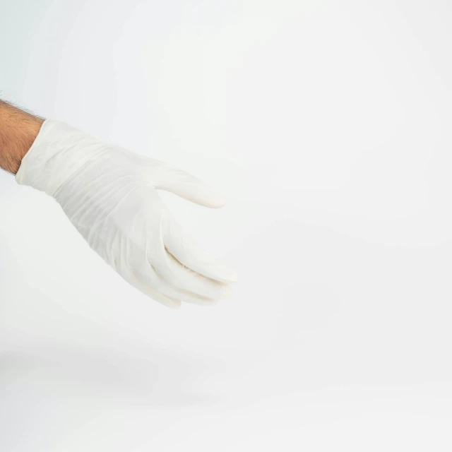 the white gloves are worn by a man with his arm up