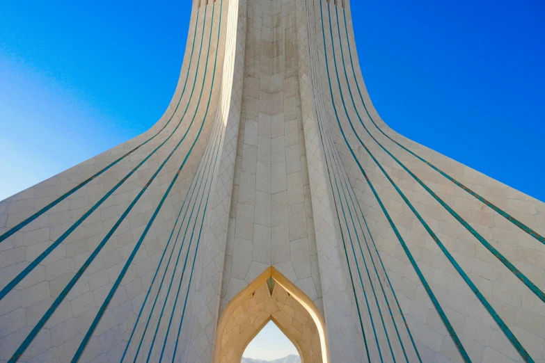 a tall building has many wavy lines on the facade