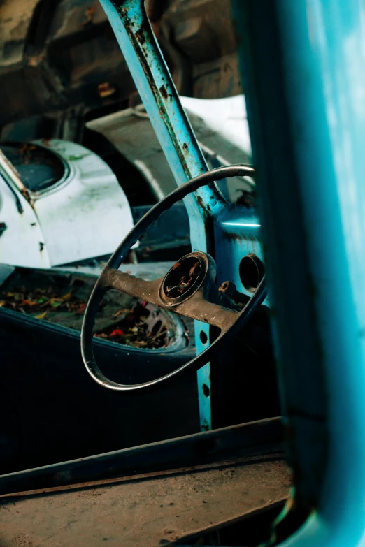 the inside view of an old car in a junkyard