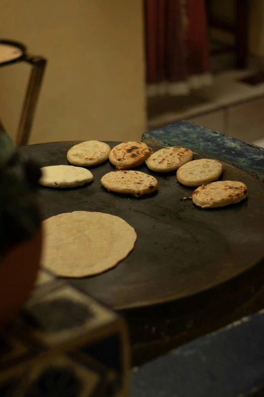 cookies are cooked on top of a large table