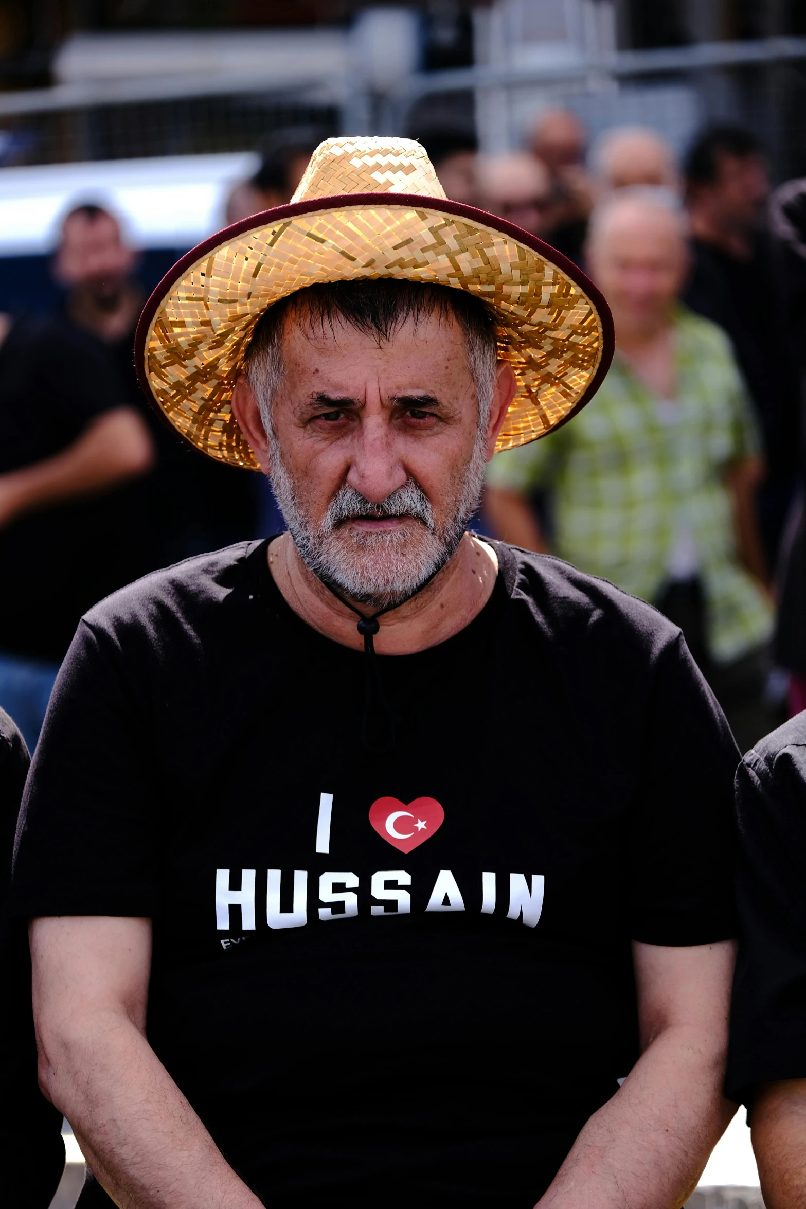 a man sitting down in front of a group of people