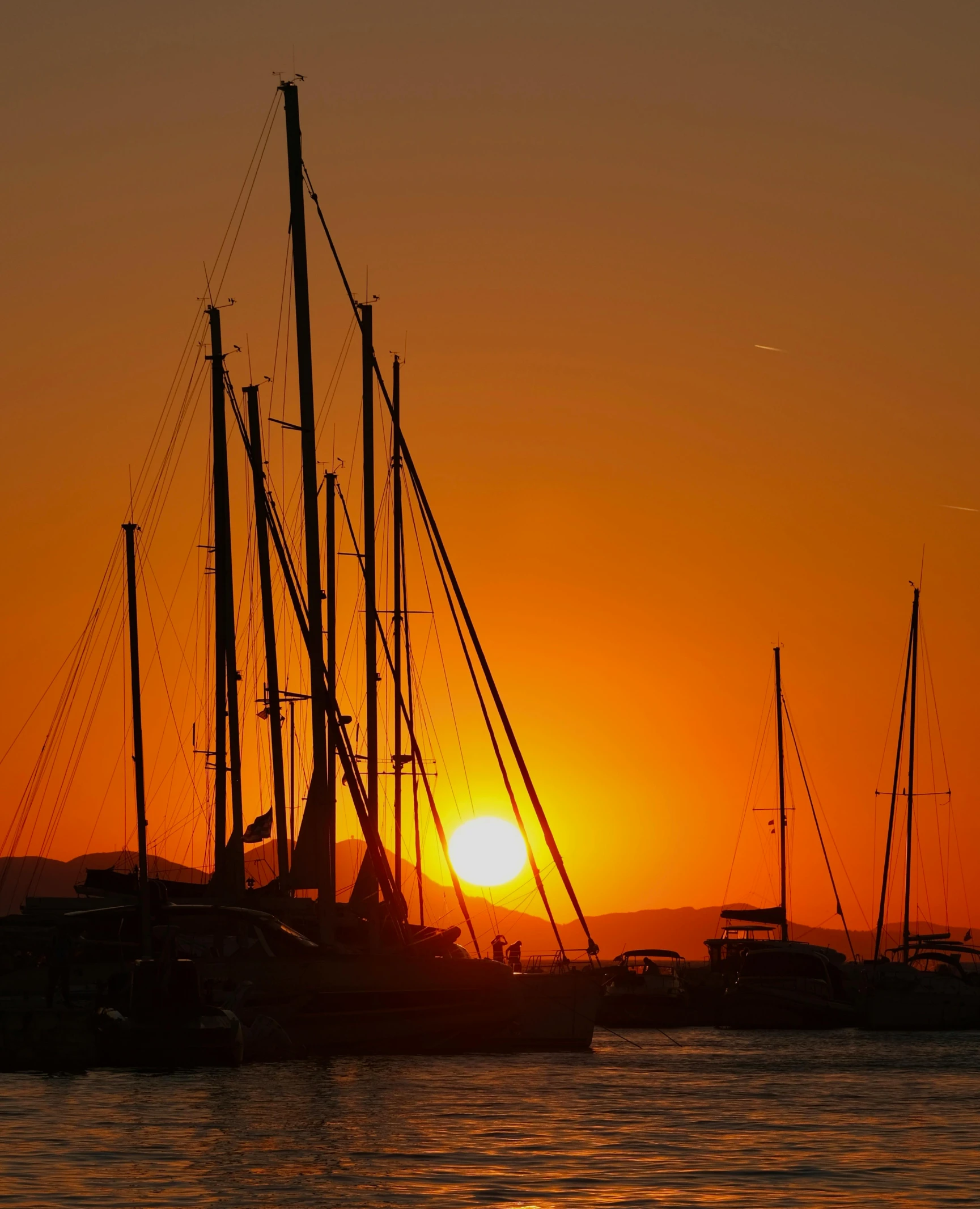 this po shows boats at sea at sunset