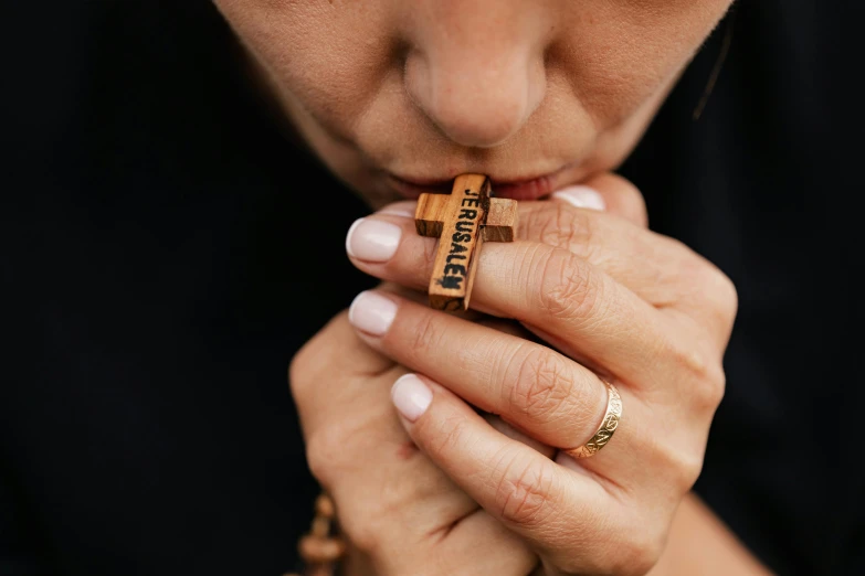 a woman has two rings on her hand