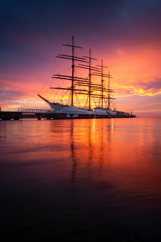 a very large boat floating by in the water