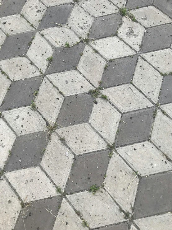 the pavement is grey with many small white dots