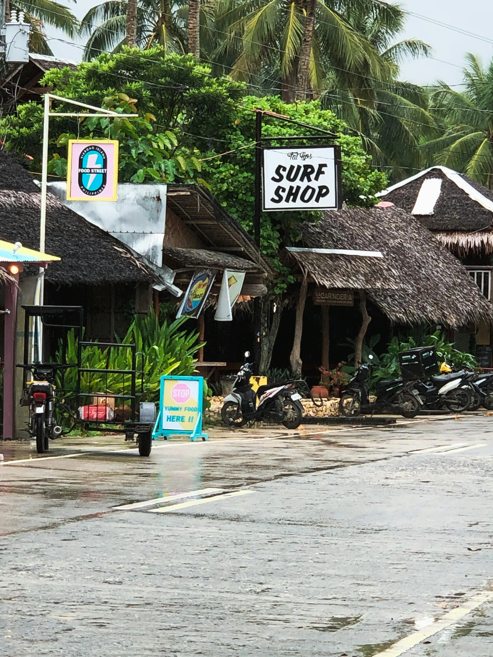 a street with motorcycles parked in front of it