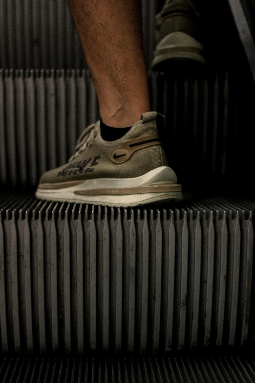 there is a shoe that is being held on an escalator